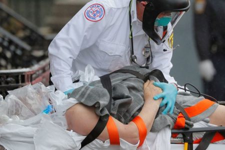 Boston EMS medics work to resuscitate a patient on the way to the ambulance amid the coronavirus disease (COVID-19) outbreak in Boston, Massachusetts, U.S., April 27, 2020. REUTERS/Brian SnyderReuters