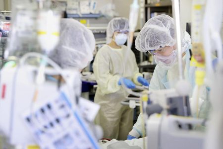 FILE PHOTO: Medical workers treat a coronavirus disease (COVID-19) patient in the ICU of St. Marianna Medical University Hospital in Kawasaki, Japan April 23, 2020, in this photo taken by Kyodo. Mandatory credit Kyodo/via REUTERS