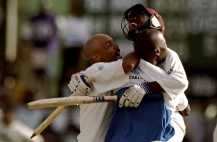 FLASHBACK: Brian Lara is embraced by Jimmy Adams (left) and Curtly Ambrose after hitting the winning runs in the third Test against Australia in 1999. 
