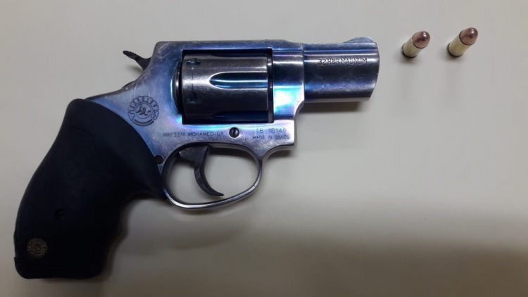 The unlicensed pistol and two live rounds which were handed over to the police. (Guyana Police Force photo)