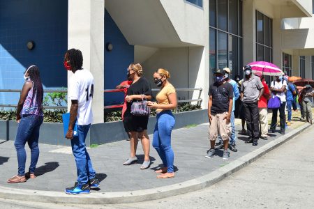 A social distancing line outside of Republic Bank (Guyana) on Camp Street on Thursday. The ATM there usually has dozens of people in close proximity to each other. The COVID-19 pandemic has changed that. (Orlando Charles photo)