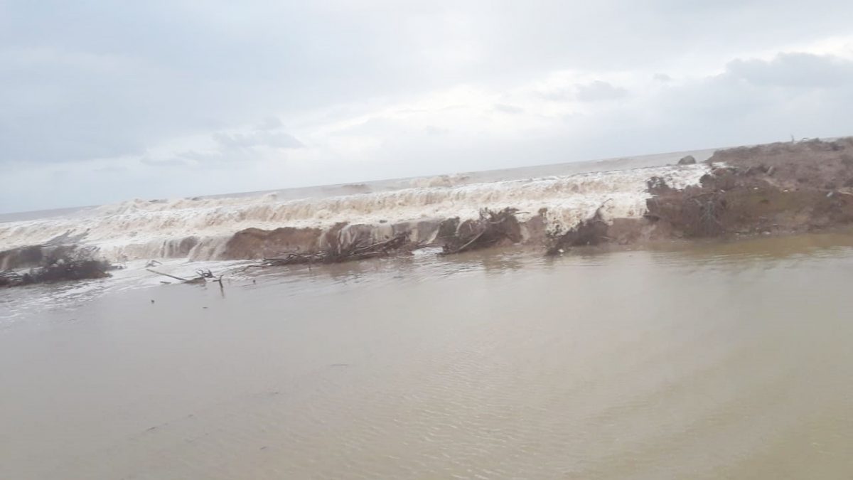 Waves overtopping the eroding section of sea defence at Content, Mahaicony 