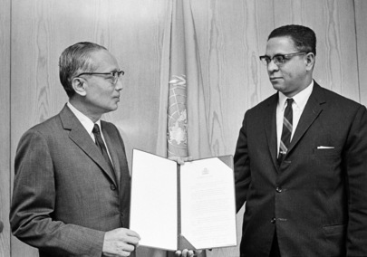 Aloysius Paterson Thompson (right), the Permanent Representative of Guyana to the United Nations, presenting his credentials to Secretary-General U Thant at United Nations Headquarters on 19 August 1969. (UN photo)