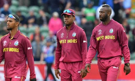 West Indies' Kemar Roach (R) walks off the pitch with teammates after losing the 2019 Cricket World Cup group stage match between West Indies and Bangladesh at The County Ground in Taunton, southwest England, on June 17, 2019. (Photo by Saeed KHAN / AFP) / RESTRICTED TO EDITORIAL USE        (Photo credit should read SAEED KHAN/AFP/Getty Images)