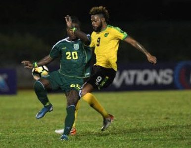 Jamaica’s Ricardo Morris (right) gets up close with Guyana’s Trayon Bobb to make a challenge during their Concacaf Nations League match at the Montego Bay Sports Complex on Monday, October 18, 2019. Social-distancing protocol requires persons to stay at least three feet away from each other to help curtail the transmission of COVID-19, posing questions for the resumption of contact sports such as football.