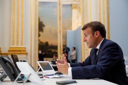 French President Emmanuel Macron speaks with Tedros Adhanom Ghebreyesus, Director General of the World Health Organization and other world leaders about the coronavirus outbreak during a video conference at the Elysee Palace in Paris, France, April 24, 2020. Christophe Ena/Pool via REUTERS