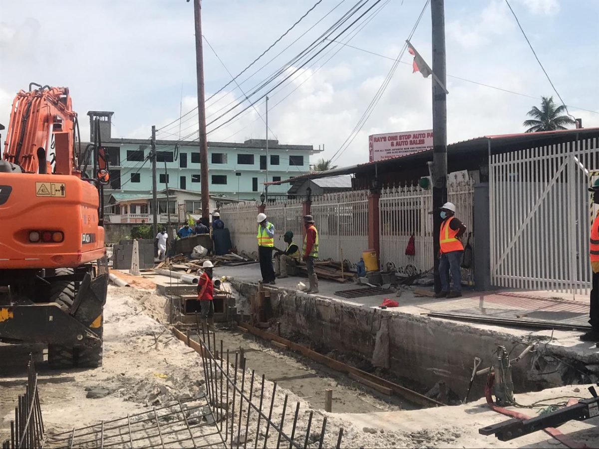 Workers on the project executing drainage work
