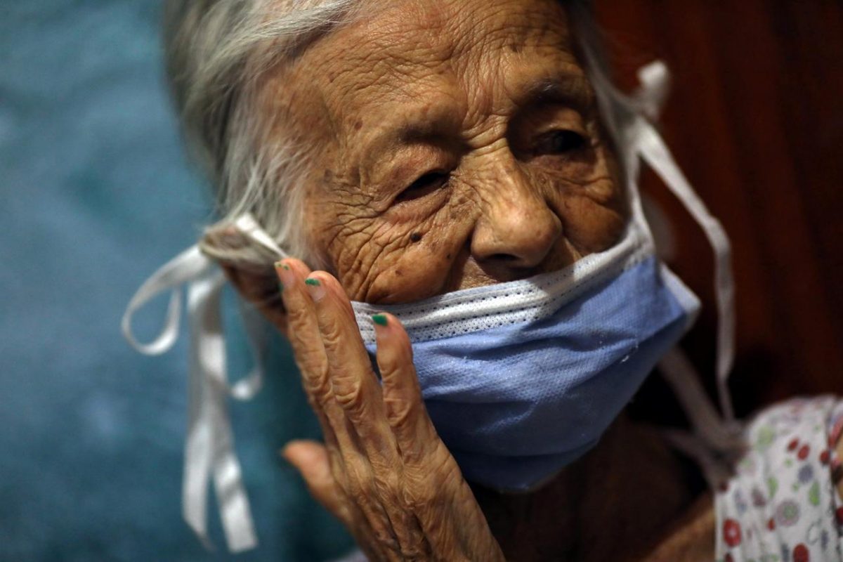 Maria Araque, 90, wears a protective mask at her house during the nationwide quarantine due to the coronavirus disease (COVID-19) outbreak in Caracas, Venezuela March 25, 2020. Picture taken March 25, 2020. REUTERS/Manaure Quintero
