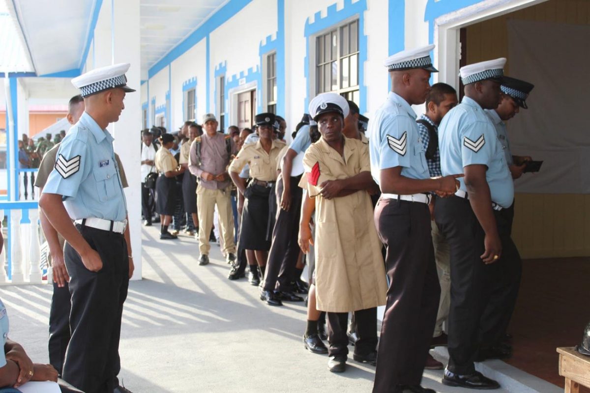 Members of the Guyana Police Force line up to cast their ballots on February 21. A total of 8,369 of the 10,226 ranks from the Guyana Defence Force (GDF), the Guyana Police Force and the Guyana Prison Service who were eligible to vote cast a ballot on that day.
