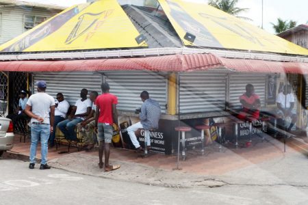 Patrons of the Guinness Bar on the Plaisance Line Top had varying approaches yesterday to dealing with the COVID-19 threat. The authorities have warned younger men, in particular, to observe social distancing and other precautions as the number of cases continues to rise.