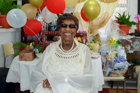 Still a social butterfly: Albertha Hicks spent her 100th birthday being pampered by close family members yesterday. Hicks told Stabroek News that her secret to longevity is the way in which she has lived her life. The new centenarian, who still enjoy socials, advised the younger generation to take time and enjoy life while being respectful of others. (Orlando Charles photo)