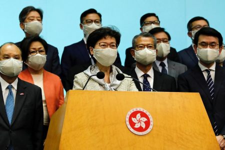 FILE PHOTO: Hong Kong Chief Executive Carrie Lam, wearing a face mask following the coronavirus disease (COVID-19) outbreak, attends a news conference with officers over Beijing’s plans to impose national security legislation in Hong Kong, China May 22, 2020. REUTERS/Tyrone Siu