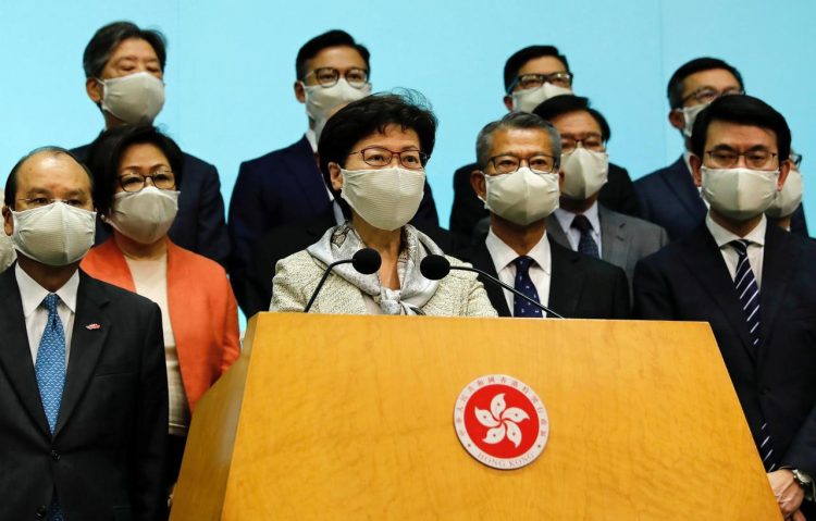 FILE PHOTO: Hong Kong Chief Executive Carrie Lam, wearing a face mask following the coronavirus disease (COVID-19) outbreak, attends a news conference with officers over Beijing’s plans to impose national security legislation in Hong Kong, China May 22, 2020. REUTERS/Tyrone Siu
