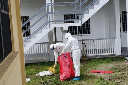 Medical staff cleaning the compound (Ministry of Public Health photo)