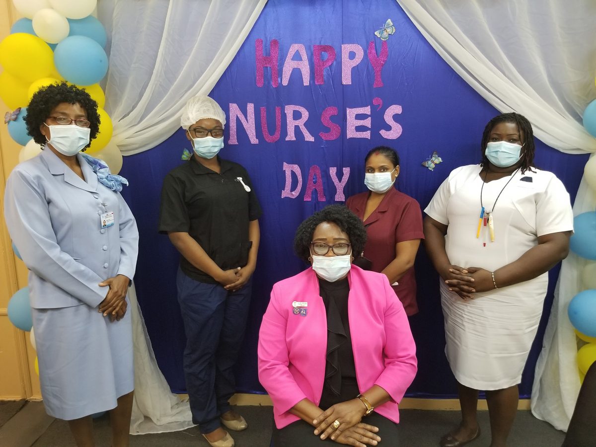 The heroes: From left to right are nursing consultant Dr Mandy LaFleur, registered nurse Napeth Dey, acting Senior Departmental Supervisor Shivani Ramdihol and staff nurse midwife Niketa Wickham. Seated is Assistant Director of Nursing Celeste Johnson-Gordon. All of the nurses, except Dr La Fleur, who is attached to the Ministry of Public Health, work at the Georgetown Public Hospital.

