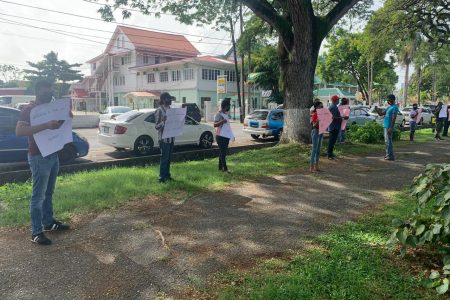 A number of persons yesterday protested outside the official residence of the Prime Minister and the Ministry of Foreign Affairs demanding that the Carter Center be allowed to enter the country to observe the national recount.
