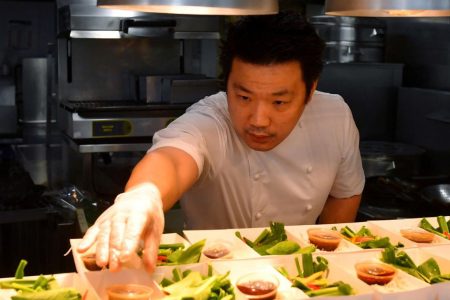 Andrew Wong, Michelin starred chef at A. Wong, prepares food at his restaurant for the elderly and needy, as as the spread of the coronavirus disease (COVID-19) continues, in London, Britain, March 24, 2020. (REUTERS/Dylan Martinez file photo) 