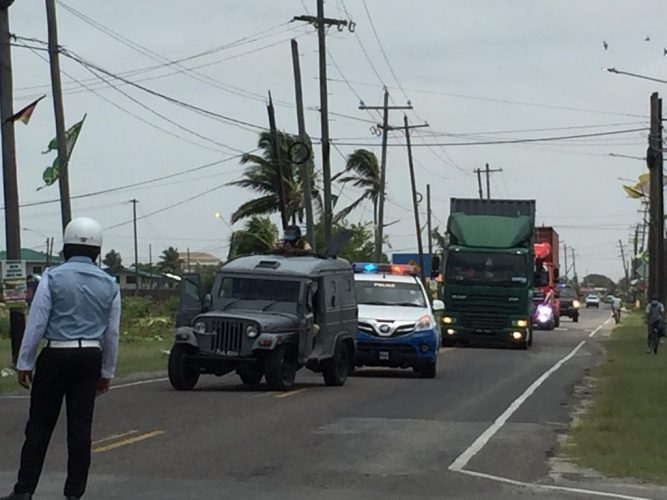 The police force's armoured vehicle escorting containers with ballot boxes this morning. (Sharda Bacchus photo)