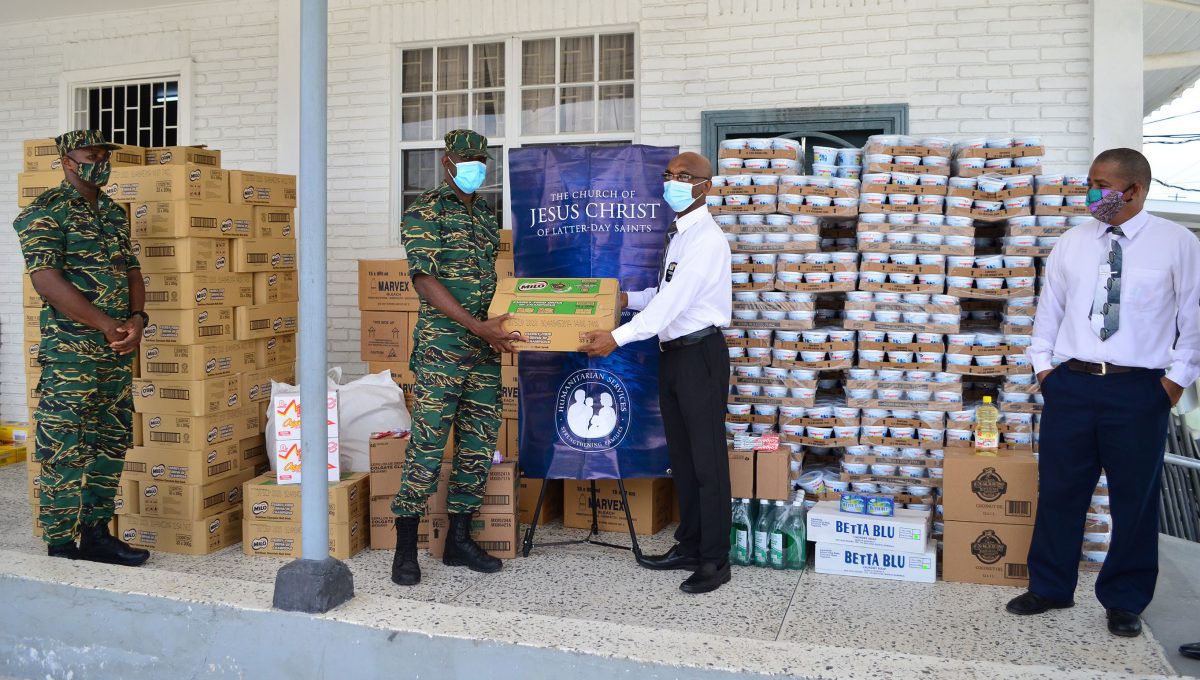 Church donates $20M in food supplies to CDC for COVID-19 relief:  Civil Defence Commission Director-General Kelvin Craig (at left) during the 
handing over yesterday by the Latter-Day Saints Church’s representative Wayne Barrow. (Photo by Orlando Charles)