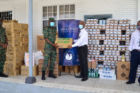 Church donates $20M in food supplies to CDC for COVID-19 relief:  Civil Defence Commission Director-General Kelvin Craig (at left) during the
handing over yesterday by the Latter-Day Saints Church’s representative Wayne Barrow. (Photo by Orlando Charles)
