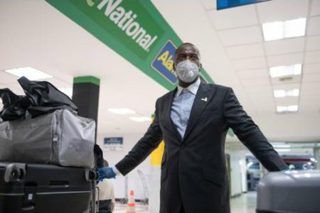 A relieved Michael Forrester stands with his luggage at the Norman Manley International Airport yesterday evening. One hundred and fifteen Jamaicans, including 75 ship workers, landed in Kingston after being stranded for weeks in the United Kingdom. The group arrived aboard a TUI charter flight. (Gladstone Taylor/Multimedia Photo Editor)