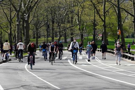 In this file photo people ride bikes and walk in Central Park during the coronavirus pandemic on April 25, 2020 in New York City. (Photo: AFP)
