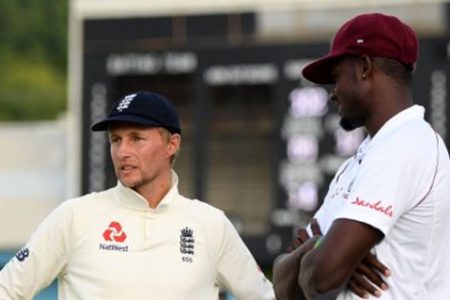 England captain Joe Root (left) speaks to opposite number Jason Holder during the 2019 series.
