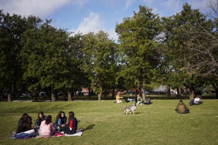 People sit together in a park as the country has managed to get the coronavirus disease (COVID-19) under control, in Montevideo, Uruguay May 23, 2020. Picture taken May 23, 2020. REUTERS/Mariana Greif