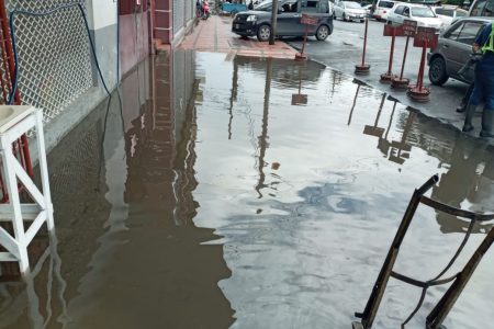 The flooded pavement outside the store on Tuesday