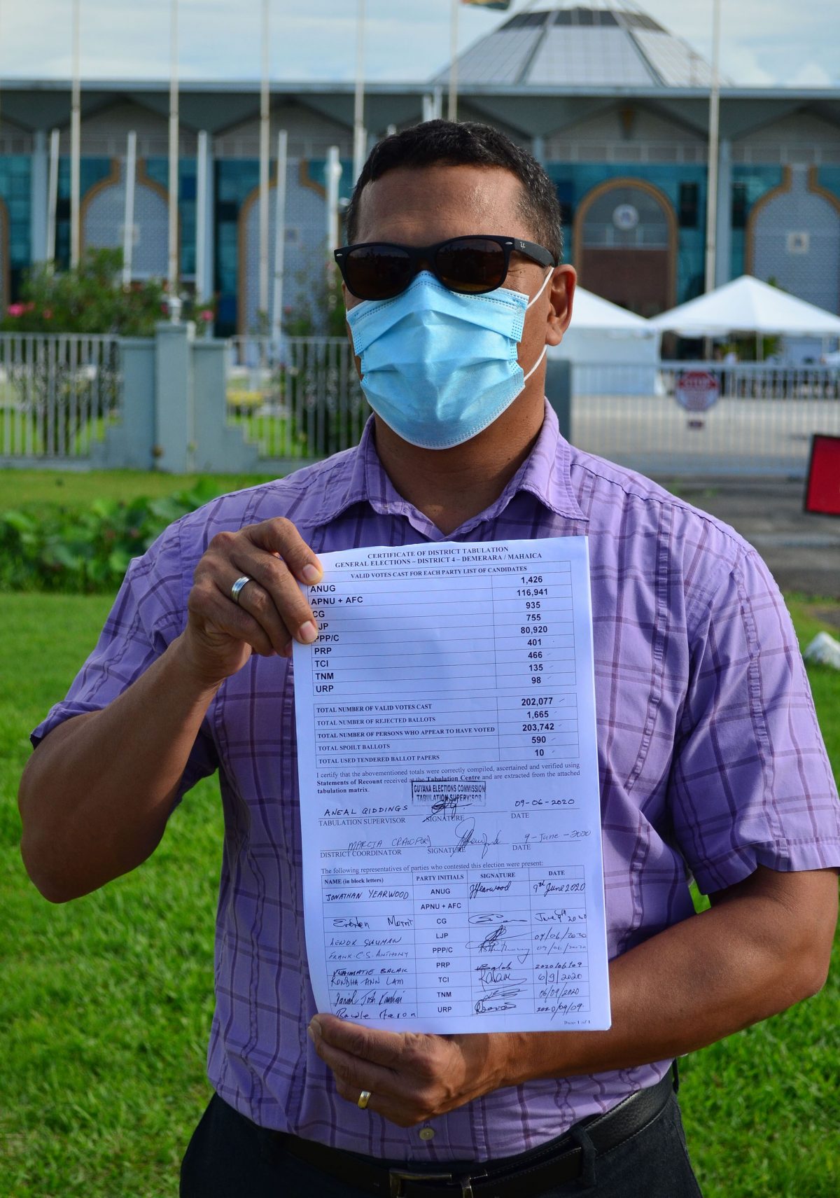 Presidential candidate of the Liberty and Justice Party Lenox Shuman displaying the District Four certificate of recount. 