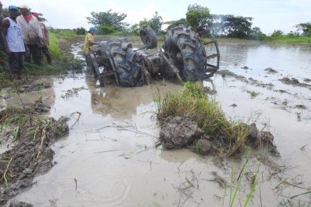 The overturned tractor which pinned Ganeshwar Jahaman