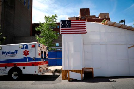 An ambulance is seen backed up to a temporary morgue outside Wyckoff Heights Medical Center in Brooklyn, during the outbreak of the coronavirus disease (COVID-19) in New York City, New York, U.S., May 27, 2020. REUTERS/Mike Segar/File Photo