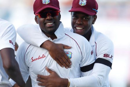 West Indies’ Darren Bravo and Shimron Hetmyer celebrate the end of an England innings during a Test match at the Sir Vivian Richards Stadium, North Sound, Antigua and Barbuda, February 2, 2019 Action Images via Reuters/Paul Childs/File Photo
