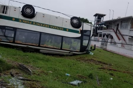 The overturned bus.