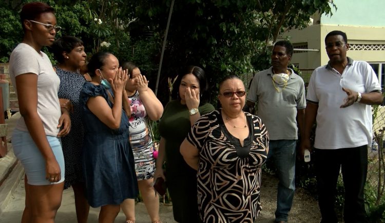 Family and friends of Joel Jacobs at their home in Second Caledonia, Morvant yesterday.