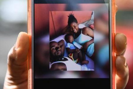 A cellphone displaying a photo of Jamaica Defence Force soldier Lexton Clayton (right), her boyfriend Kymani Taylor and their son Tyler. All three were found dead in St Thomas on June 7, 2020 – Contributed photo