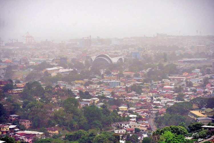 UNHEALTHY HAZE: An overhead view of Belmont and the National Academy for the Performing Arts (NAPA) shows the hazy effect due to heavy Saharan dust in the air on Sunday. —Photo: ISHMAEL SALANDY