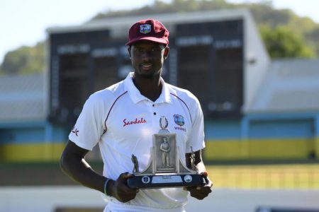 West Indies skipper Jason Holder proudly displays the Wisden Trophy, the two sides will battle for.