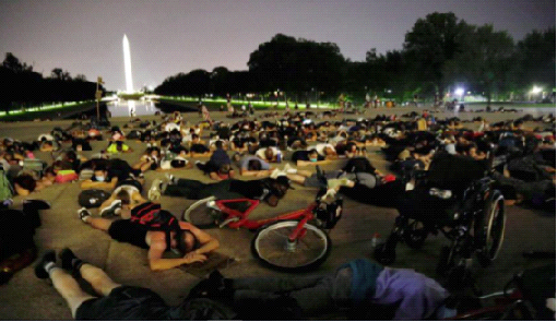 Demonstrators lie down during a protest against racial inequality in the aftermath of the death in Minneapolis police custody of George Floyd at the Lincoln Memorial in Washington, U.S., June 6, 2020. REUTERS/Joey Roulette