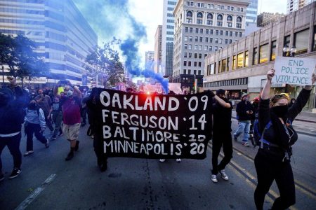 In this May 29, 2020, photo demonstrators march in Oakland, California, protesting the death of George Floyd, a handcuffed black man in police custody in Minneapolis. (Photo: AP)