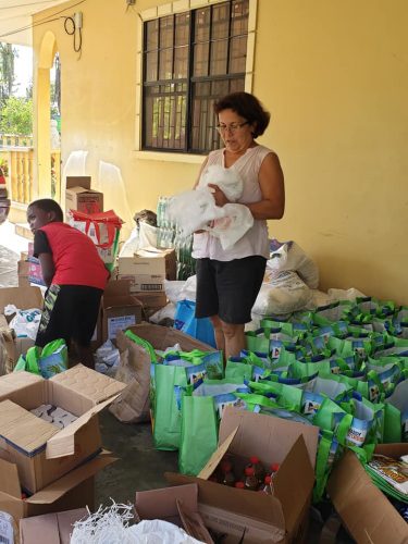 Stephanie Fraser preparing the first set of hampers that were expected to arrive in Santa Rosa yesterday