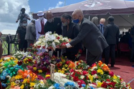 Barbados Prime Minister Mia Mottley (centre) along with Professor Hilary Beckles (left) and close friend of the Weekes family, Adrian Donovan, lay a wreath on the grave of Sir Everton Weekes. 