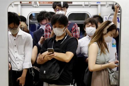 Passengers wearing protective masks amid the coronavirus disease (COVID-19) outbreak, ride a subway train in Tokyo, Japan, on July 3, 2020. (REUTERS/Kim Kyung-Hoon photo) 