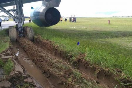 The wheels of the Boeing 767 aircraft were stuck after it skidded off the runway. (DPI photo)