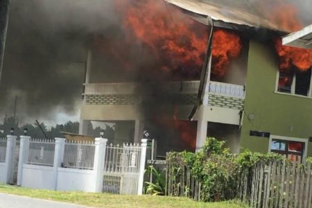 The house engulfed by flames