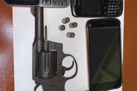 The unlicensed revolver with live rounds and phones that were allegedly found in possession of the men