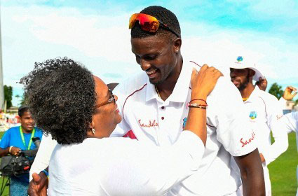 FLASHBACK: Prime Minister Mia Mottley congratulates West Indies captain Jason Holder immediately following the side’s win over England in the first Test at Kensington Oval last year. 