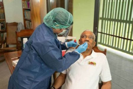 President David Granger having his sample taken for the COVID-19 test (DPI photo) 