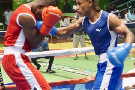 Top Boxer, Keevin Allicock (right), still has his sights set on earning Guyana’s next Olympic medal. (Emmerson Campbell photo)
