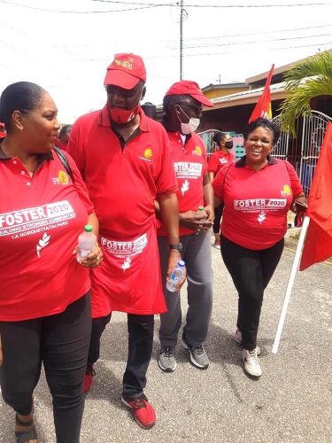 Retired Brigadier General Ancil Antoine, second from left, chats with supporters during a PNM walkabout on Saturday in La Horquetta/Talparo.